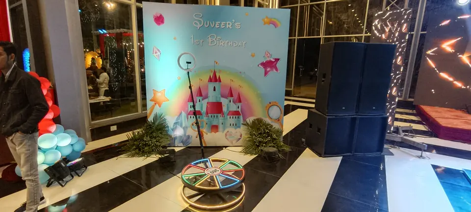 Birthday themed backdrop with 360 booth camera setup in Jaipur