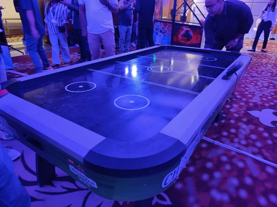 Black air hockey table for corporate guest engagement in Jaipur