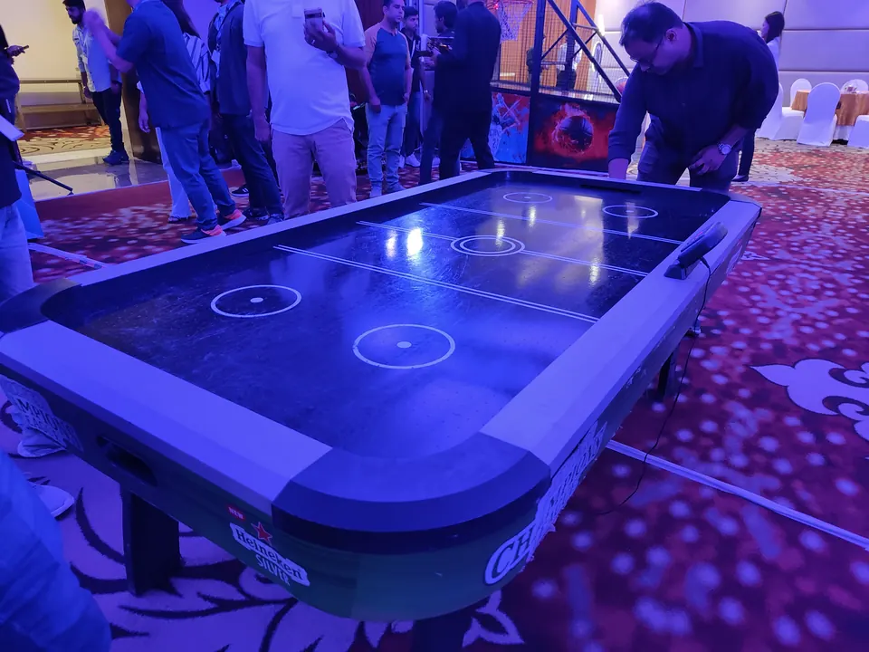 Premium black air hockey table placed at an indoor event in Jaipur