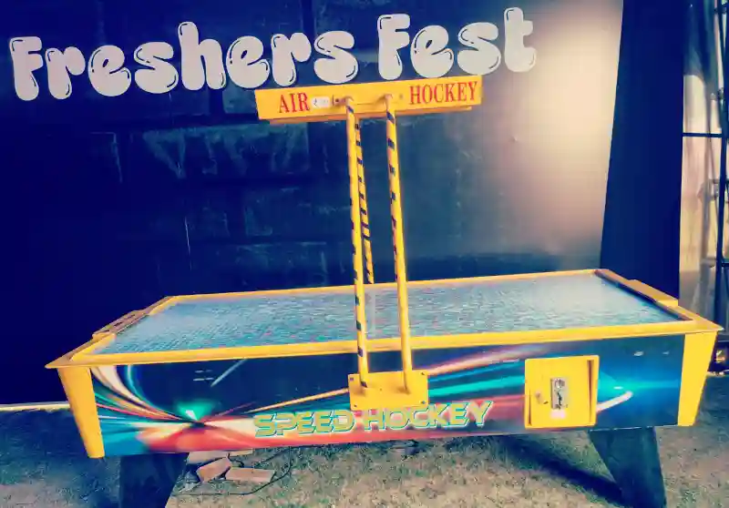 Guests playing air hockey at a Goa celebration