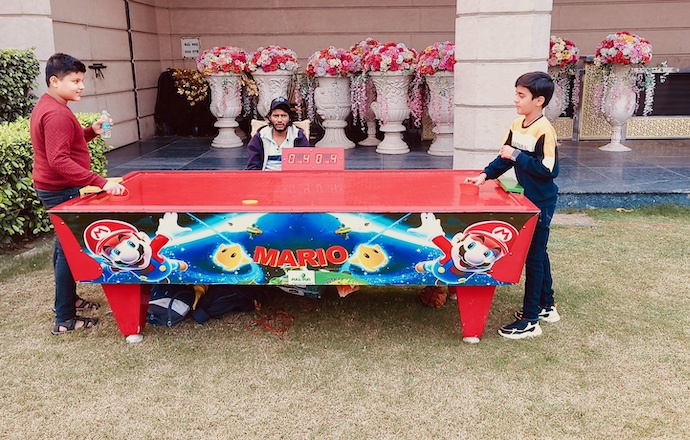 Air Hockey Table Rental Kanpur, party game rentals, air hockey for events, wedding entertainment ideas, corporate event games, school event activities, college fest games, Page One Memories