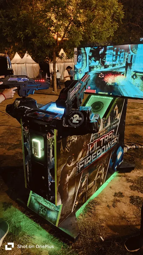 Alien shooter arcade machine set up at a night event in Mumbai