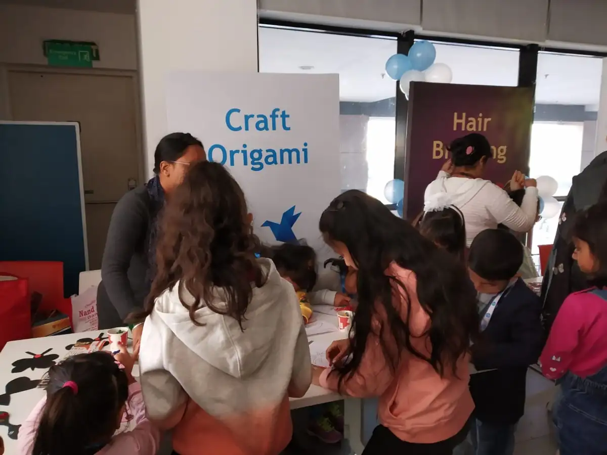 Children enjoying a guided art and craft workshop