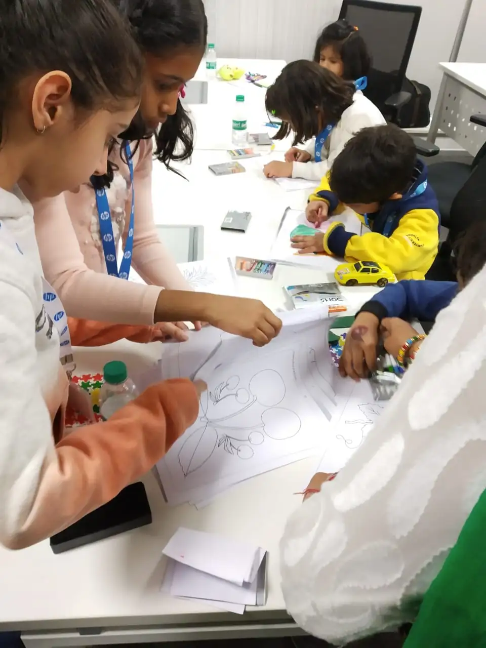 Children working together at an art and craft counter