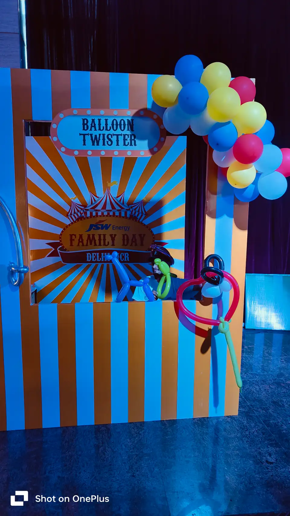 Balloon artist presenting custom balloon sculptures