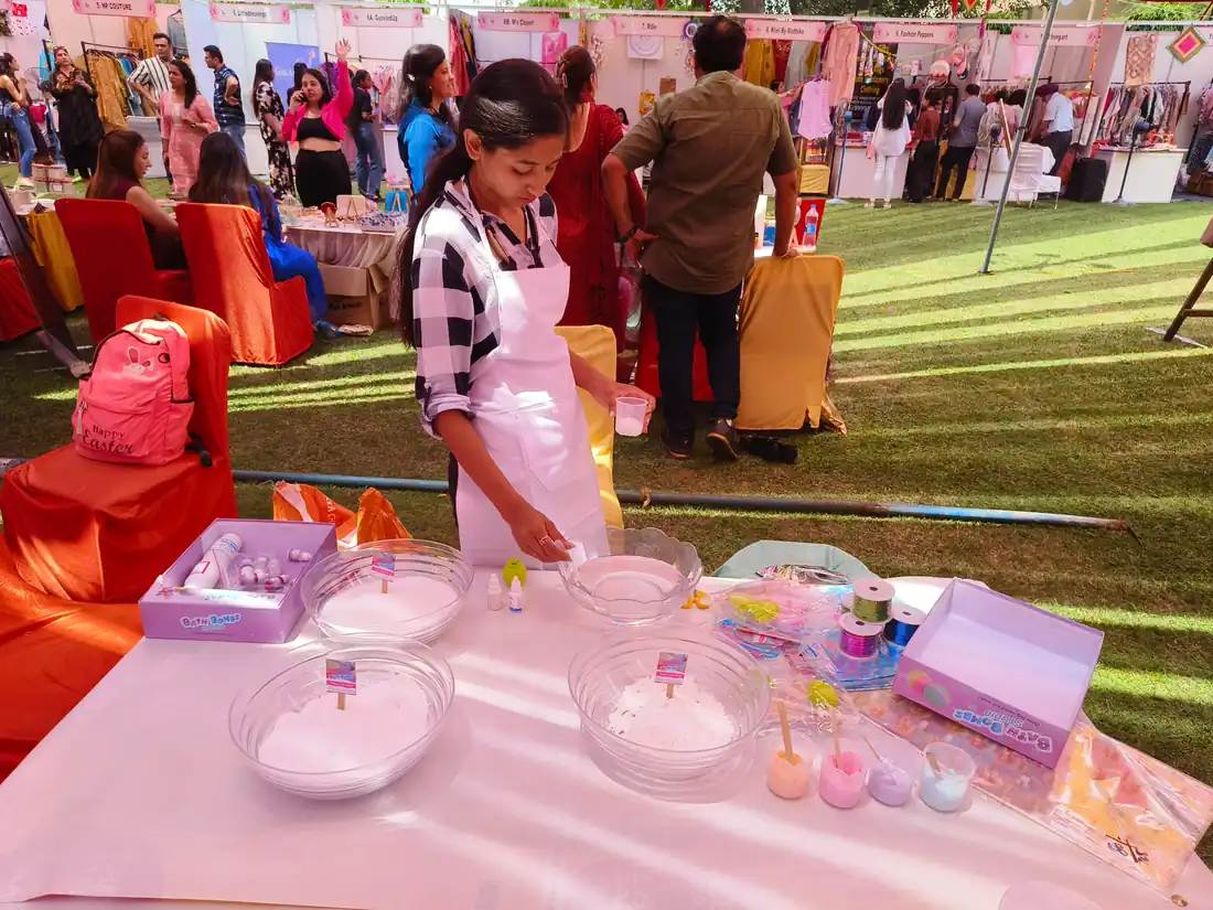 Guests enjoying bath bomb activity setup in Agra