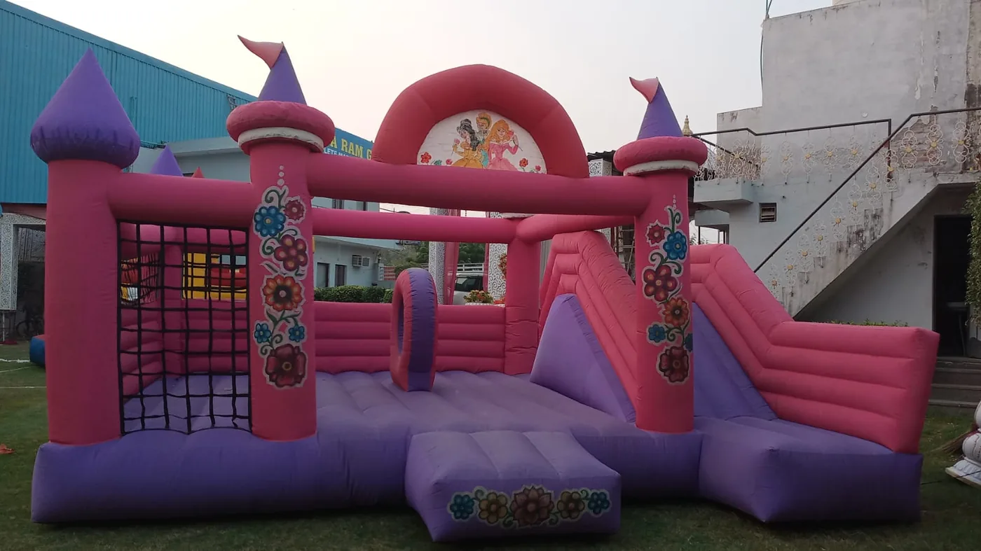 Pink princess bouncy castle with slide available for kids events in Mumbai