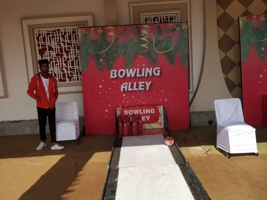 Guests enjoying bowling alley game during a Lucknow celebration