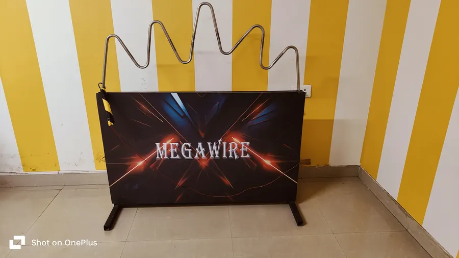 Guests enjoying buzz wire game during a Gurgaon celebration