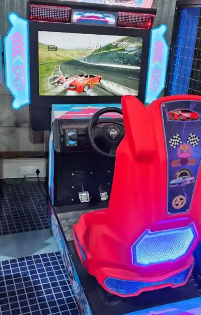 Arcade racing machine ready for guest play in Gurgaon