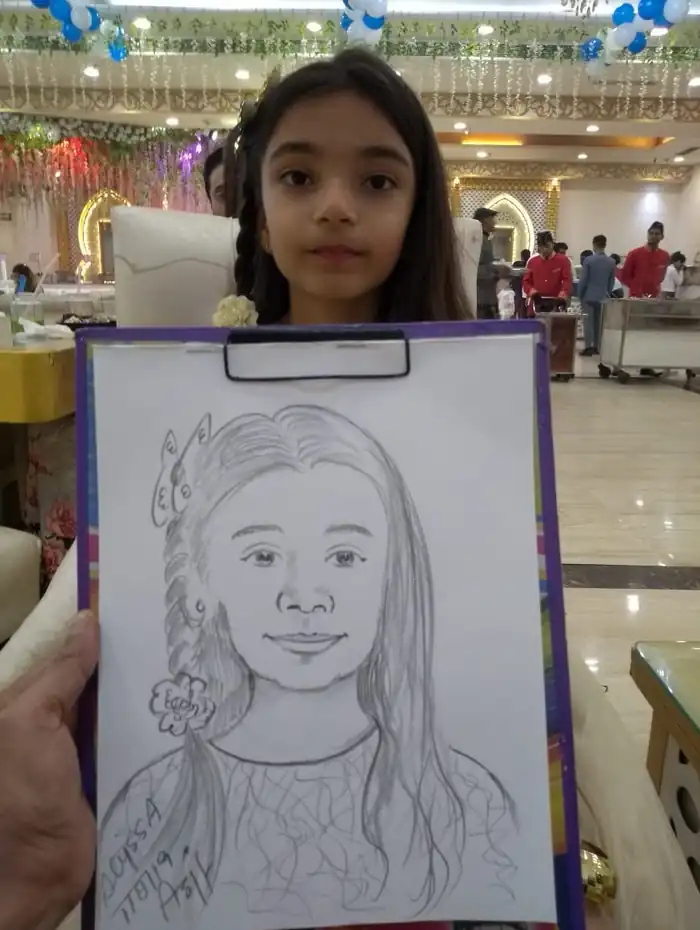 Event guest displaying a finished hand-drawn caricature portrait
