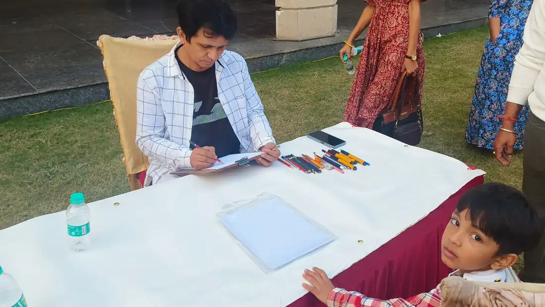 Live caricature artist sketching a guest at an outdoor event