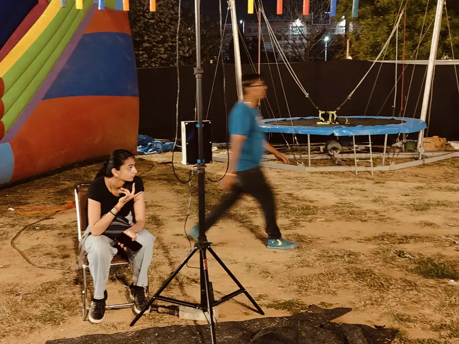 Guests enjoying catch the stick game during a Mumbai celebration