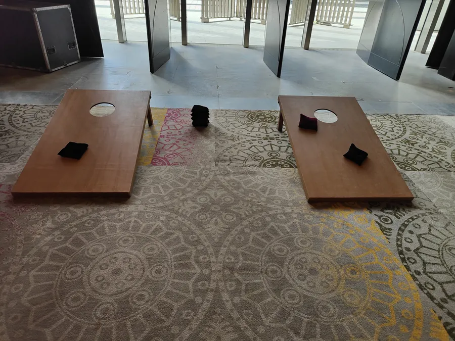 Guests enjoying cornhole game during a Mumbai celebration