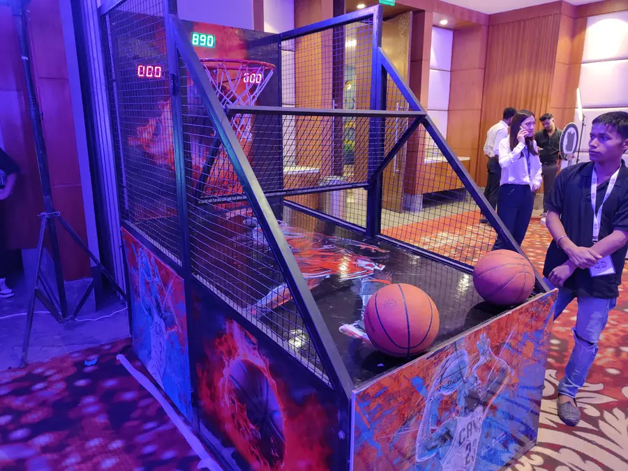 Guests enjoying electronic basketball game during a Chandigarh celebration