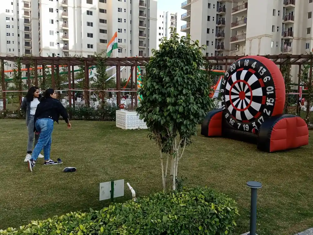Guests enjoying the Foot Dart game at an outdoor event in Mumbai