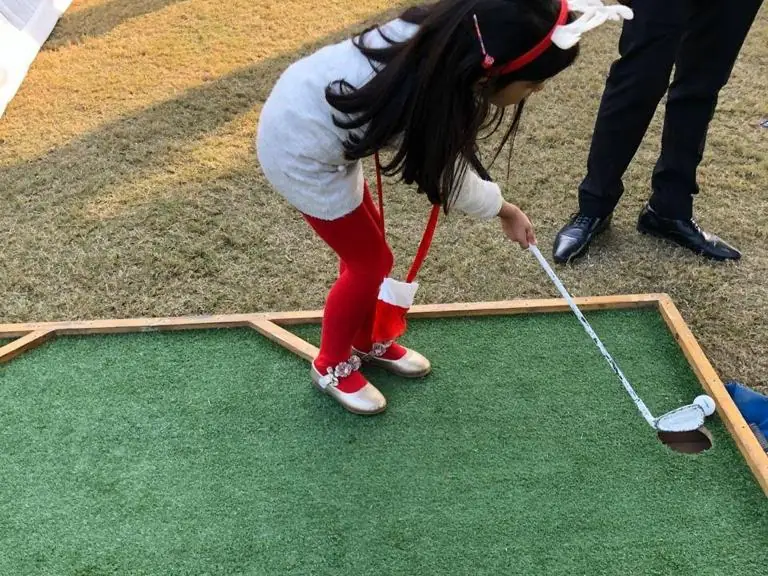 Guests enjoying mini golf game during a Mumbai celebration