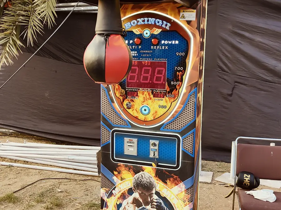 Guests enjoying power punch arcade game during a Chandigarh celebration